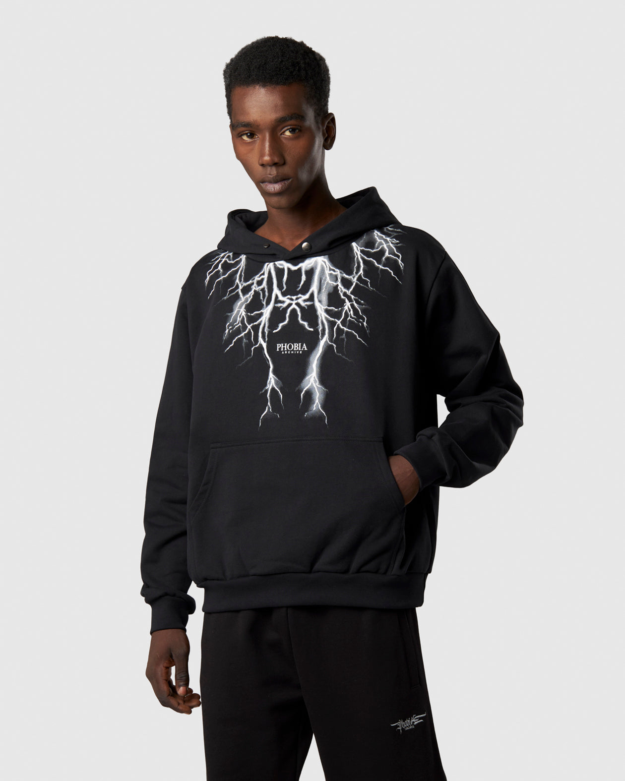 BLACK HOODIE WITH GRAY LIGHTNING AND LOGO PRINT